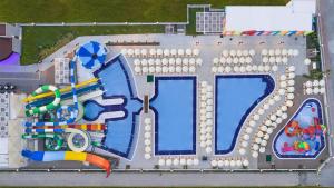 an aerial view of a water park with a pool at Greenwood Suites Resort in Lara