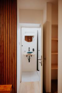 a bathroom with a sink in a room at Apartment Slupečná Lipno in Kramolín +13 photos