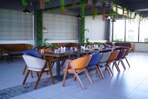 a dining room with a long table and chairs at Hotel Starwing in Pāonta Sāhib