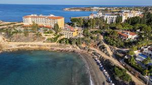 an aerial view of a resort and a beach at Thalassa Boutique Hotel & Spa in Paphos