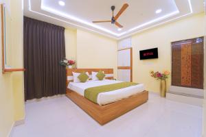 a bedroom with a bed and a tv in it at I&S Residency in Rāmanāthapuram