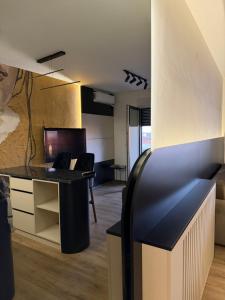 an office with a desk and a chair in a room at T&M Apartman Premium 2 in Paraćin
