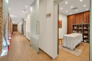 a long hallway with a table in a room at Albufeira Sol Hotel & Spa in Albufeira +33 photos