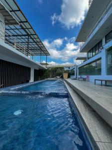 a swimming pool in the middle of a house at The Hermitage Tagaytay-Junior Suite in Malabag