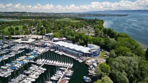 an aerial view of a marina with boats docked at Bodensee Yachthotel Schattmaier in Kressbronn am Bodensee