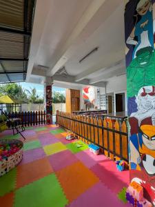 a room with a fence and a colorful floor at The Hermitage Tagaytay-Junior Suite in Malabag