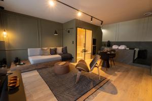 a living room with a bed and a table at My Spa in Reims