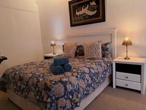 a bedroom with a large bed with two night stands at Fiore Guest Accommodation in Greyton