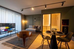 a living room with a bed and a table at My Spa in Reims