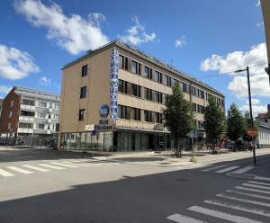 a building with a sign on the side of it at Best Western Hotel Apollo in Oulu