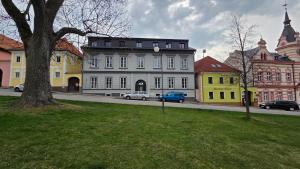 a city street with cars parked on the road at Apartmán Square Lipno in Horní Planá