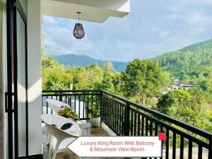 a balcony with a view of a mountain view at Rock Face Palace in Ella