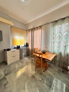 a kitchen with a wooden table in a room at Diamond Studio Apartment - Haifa in Haifa