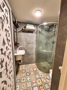 a bathroom with a shower and a sink at Diamond Studio Apartment - Haifa in Haifa +18 photos