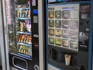 a vending machine filled with drinks and drinks at ibis budget Saint-Omer Centre in Saint-Omer