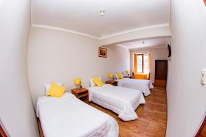 Letto o letti in una camera di Cusco House