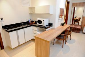 Kuchyň nebo kuchyňský kout v ubytování Faria Lima Flat Service