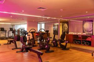 a gym with treadmills and ellipticals in a room at Barceló Anfa Casablanca in Casablanca
