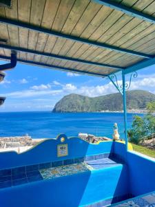 a view of the ocean from a house at Holiday Home Case Blu in Lipari