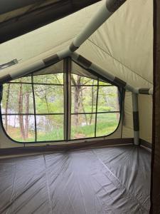 a view of a window in a tent at Sanovia Glamping Max in Reczpol
