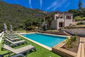 a villa with a swimming pool and a house at Villa Excelsior in Porto Ota