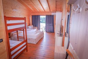 a room with a bunk bed and a bedroom at Dolanit Hotels Lalez in Draç +52 photos