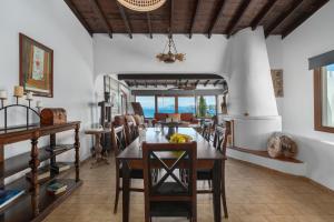 a dining room with a table and chairs at Liogerma Boutique Home in Skiathos +50 photos