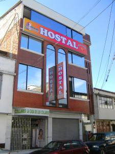 a hospital building with a sign on top of it at Hostal Fevilamir in Ibarra