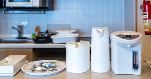 a kitchen with a counter top with a kitchen appliance at Seagaia Forest Condominiums in Miyazaki +45 photos