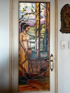a door with a painting of a woman on it at Rocamare, la Vie est Belle! in Cannes +1 photo