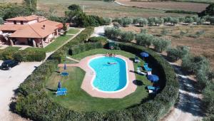 an aerial view of a house with a swimming pool at Agriturismo Radicata in Capalbio +16 photos