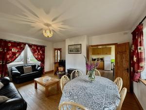 a living room with a table and a couch at Twelve Bens Lodge in Recess