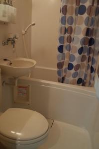 a bathroom with a toilet and a sink at 京町家 近よし in Kyoto +50 photos