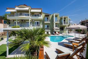 a view of a building with a swimming pool at Lafeyra Hotel in Limenaria