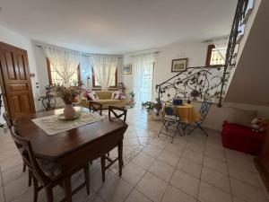 a large living room with a table and chairs at Villa G&G in Tropea