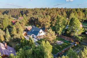 an overhead view of a large house in the woods at Country house in Dziemiany