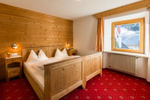 Ένα ή περισσότερα κρεβάτια σε δωμάτιο στο Hotel Lamm