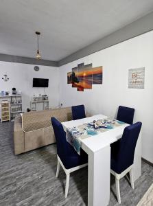 a living room with a table and a couch at Loft vista mare in Silvi Marina