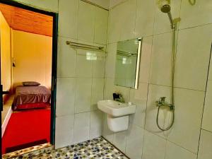 a bathroom with a toilet and a sink and a shower at Elephant homestay in Sapa