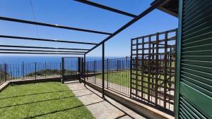 a screened in porch with a view of the ocean at Casa Vacanze Sofì in Ascea