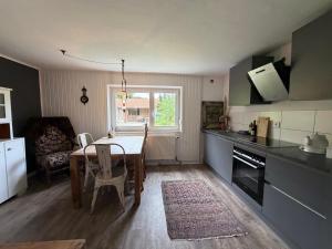 a kitchen with a table and a dining room at Kirchstett in Sankt Wolfgang