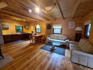 a living room with a couch and a table at Leśna Arkadia in Dominice