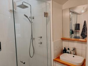 a bathroom with a shower and a sink at Slow Haus Tanunda in Tanunda +25 photos