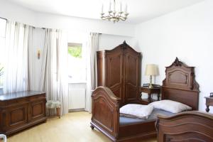 a bedroom with two beds and a dresser at Stay-In Vienna 23 in Vienna