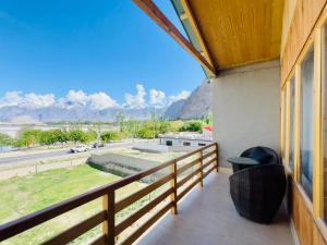 a balcony with a view of the mountains at Meechung Resort in Skardu