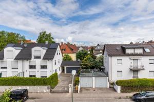 a row of white houses in a city at Loft in Augsburg