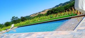 a swimming pool with a view of a mountain at Podere Cerciano in Radicondoli