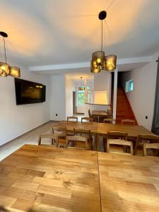 a dining room with wooden tables and chairs at Shiro Nord in Predeal