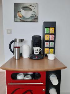 a table with a coffee maker on top of it at Zen Olive Guest Room in Antwerp