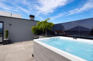 a swimming pool on the roof of a house at Palheiro 81 in Costa Nova +29 photos